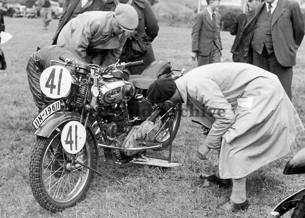 Photo #41 C Geffers 246cc Hercules [IIN 19611] a beautiful bike with much quality detailing being carefully scrutinies at weigh in in the ISDT 1937 (Courtesy Deryck Wylde)