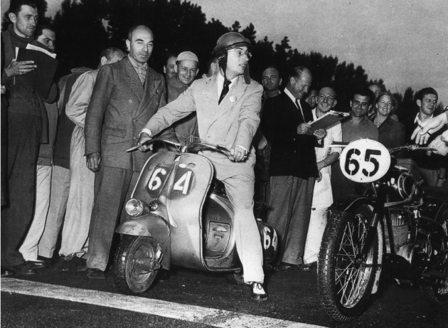 Photo of Carrini and his 98cc Vespa at the start ISDT 1951