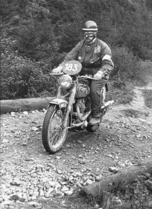 Photo - #183 Bob Ray rides by wearing the Green British Helmet in ISDT 1952