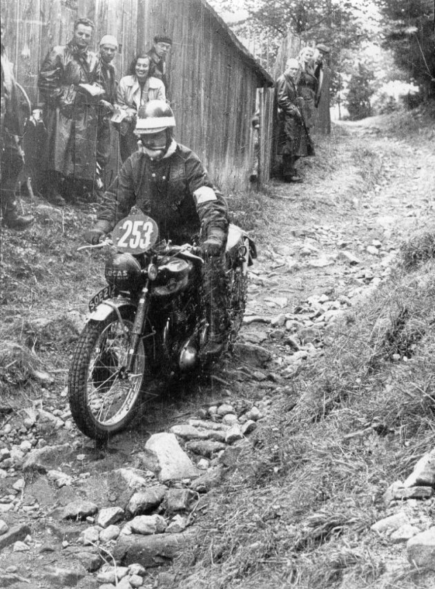 Photo - #253 Bob Ray passes spectators on his Ariel with a dinged fuel tank in ISDT 1955