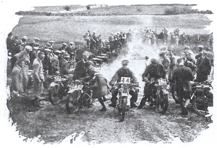 Image of #44 G E Rowley (AJS) through a number of drowned bikes with wet magnetos at the Asby Splash ISDT 1927