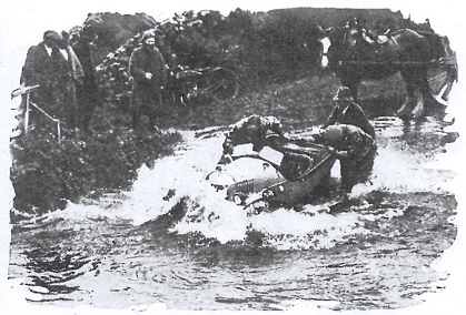 Image of competitors struggling in high water ISDT 1927