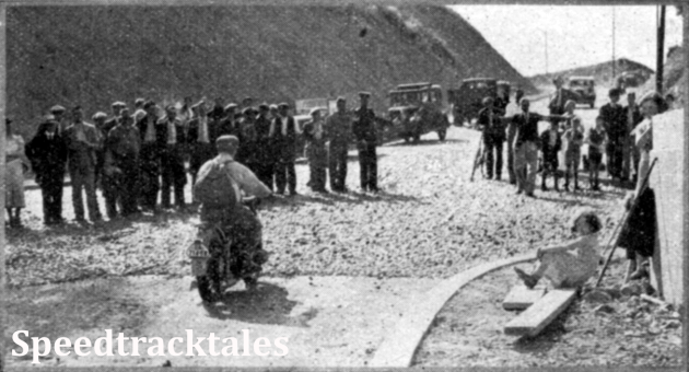 Photo - J Stelzer (496 BMW) a member of the German Trophy team, about to round a corner at Builth Wells. The surface of unrolled stones is due to road operations - ISDT 1937 (Speedtracktales Collection)