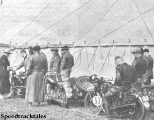 Photo - Outside the Official Marquee P Scahfer, the German, is waiting his turn to weigh-in his Victoria outfit, and behind him #53 P Gunther, a compatriot, on a 246cc Puch ISDT 1937 (Speedtracktales collection)