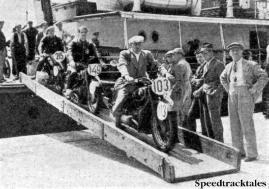 Photo - The German's have arrived! three of the German Contingent for the International Six Days Trial landing at Southampton last week. The two leading machines are BMWs and the thrid on the gang plank is a Zundapp. On the exterme right is a popular 'International' figure - the interpreter. ISDT 1937 (Speedtracktales collection)