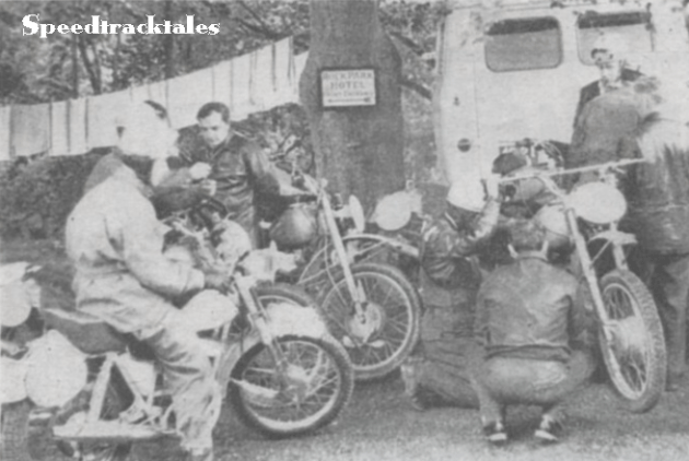 A line of towels hanging out to dry makes a domestic background for activity in the Russian camp.