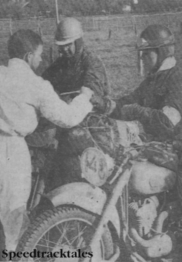 Photo - Bronze medallist Dave Clegg (Greeves) having his time card stamped with Czech rider Karel Pecha (Jawa) in Bavarian sunshine last week. ISDT 1962 (Speedtracktales Collection)