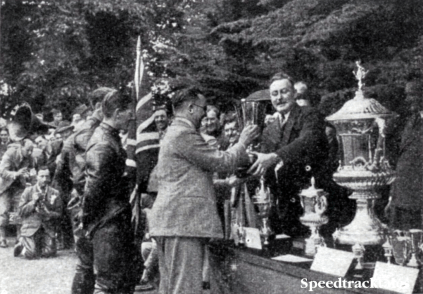 Photo- Graham Walker, Editor of 'Motor Cycling' handed the cup presented by the journal to the best Army team in the INternational Six Days to the Royal Tank Corps team, who rode BSA's during the proceedings ISDT 1938 (Speedtracktales Collection)