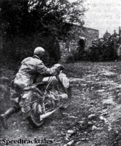 Photo - A good impression of the steepness of Fron Bache showing #52 J Forstner (BMW) of Germany's 'A' Vase team, helping the model up ISDT 1938 (Speedtracktales Collection)