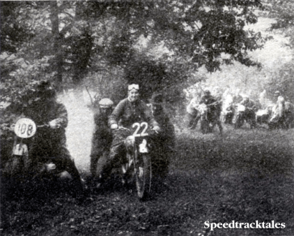 Photo #22 Mrs M L Anning (BSA) and #108 F Lindhardt (BMW) receiving assistance on Fron Bache. Observe the large group of riders in the background waiting for the opportunity to 'have a go' ISDT 1938 (Speedtracktales Collection)