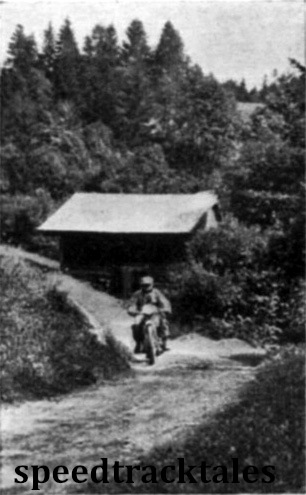 Photo - Miles of rough tracks passing through magnificent wooded country were the feature of Tuesday's run. Here is L Ridgeway (496 BSA) going hard to arrive at the St. Koloman check on time. ISDT 1939 (Speedtracktales Archive)