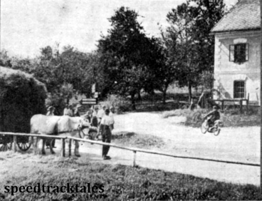 Photo - A bullock cart awaits while T Mooney (497 Ariel) passes through the village. ISDT 1939 (Speedtracktales Archive)