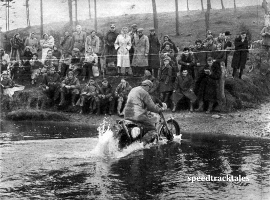 Photo - A mixed gallery watches #109 R. Wilkinson (348 Panther) trickle slowly through a water splash ISDT 1950 (Speedtracktales Archive)