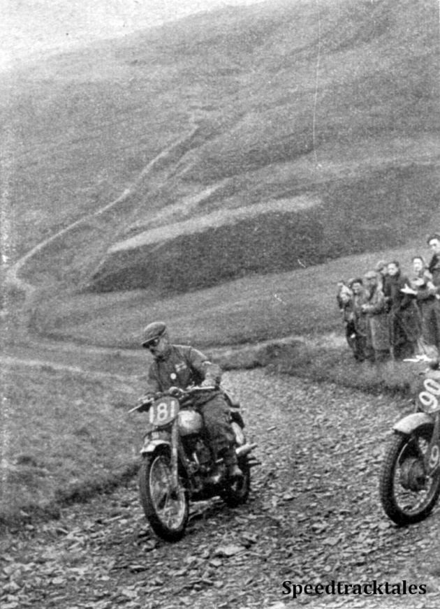 Photo - #181 PH 'Jim' Alves (Triumph) of the victorious Trophy Team scales Blaen y Cwm on Friday. The stationery front wheel on the right belongs to #90 O Messori (250cc Sertum) ISDT 1949 (Speedtracktales Collection)