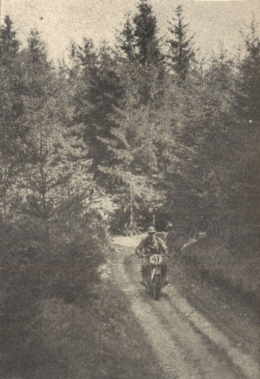 Photo - That was the typical terrain at the first day, narrow forrest tracks, interrupted by short boulder sections and large bathtubs with mud. Rider is #41 NSKK-Obersturmführer [comparable to 1. Lieutenant] Meinl of the Motorgruppe Ostmark  on BMW R 51.ISDT 1939 [Ostmark was the name for former Austria, after Germany annexed this country] (das Motorrad)