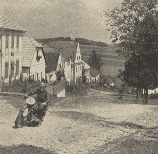 Photo – #110 The NSKK-Obertruppführer [comparable to staff sergeant] Röser, who right at his first appearance at Schönerlinde made people talk of him, did become an excellent off road rider. Here he can be seen with his BMW at a steep climb, on his way to the next to last checkpoint. ISDT 1939 (das Motorrad)