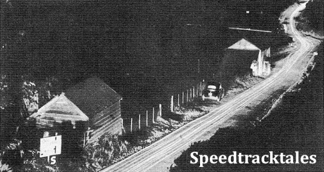 photo - The road is streaked with Orange threads of lights during Tuesday's run. Riders are travelling North on A483, which leads towards Newtown. ISDT 1954 (Speedtracktales Archive)