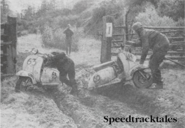 Photo Unfair to small-wheeled vehicles! Alan Kimber (left) and Roy King manhandle their Lambrettas out of footboard deep ruts at Prebersee ISDT 1960