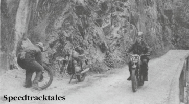Photo - Stuck on the Stein Pass! #272 R Hvezda of Czechoslovakia mends a front tyre puncture on his Jawa while Britain's Trophyman #279 Colin Moram (AJS) presses on. ISDT 1960