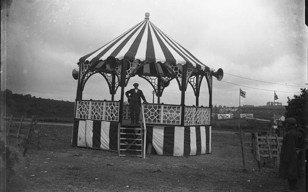 Photo of the Bandstand in Llandrindod Wells With flags and banners in the background connected to the ISDT 1938 (Courtesy National Library of Wales Rusham Roberts collection)