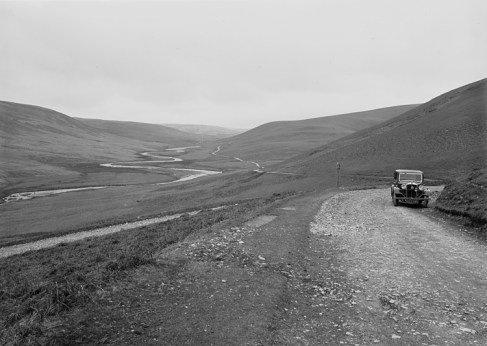 Old car on unsurfaced mountain road Mid Wales Image