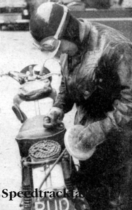 Photo - Ken shows another piece of his handiwork, the adapted - Saucepan spare-chain carrier ISDT 1960