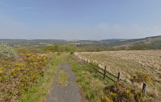 Photo - Where the tarmac runs out, with a wonderful view to distant moorlands on route Day 1 ISDT 1938 (Google Streetview)