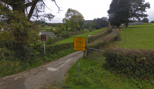 Photo - Matching insults erected at the Pentre Back end of the track at the A40 junction on route Day 1 ISDT 1938 (Google Streetview)