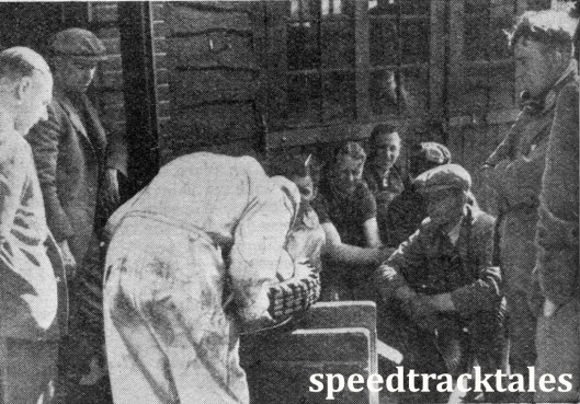 image - Even the 'stars' can learn from an expert in the art of tyre fitting. In the picture are C.F. Bladon (Royal Enfield), C.N. Rogers, A Jefferies, G.E. Rowley, R MacGregor T.C. Witton, R. Wilkinson, and G.E. Eighteen (speedtracktales collection)