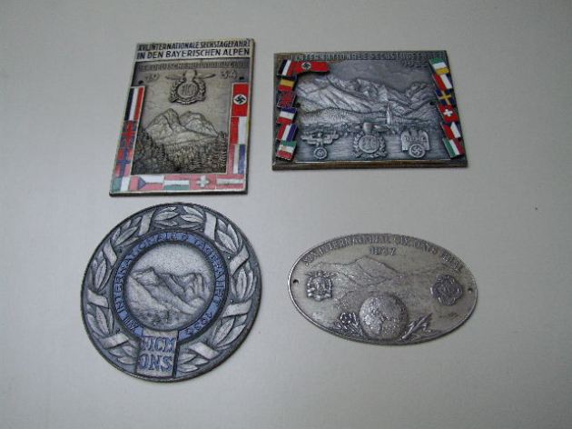 Photo - collection of competitors presentation plaques ISDT 1934 - 37 (Courtesy Stuart and Ian Leslie Collection)