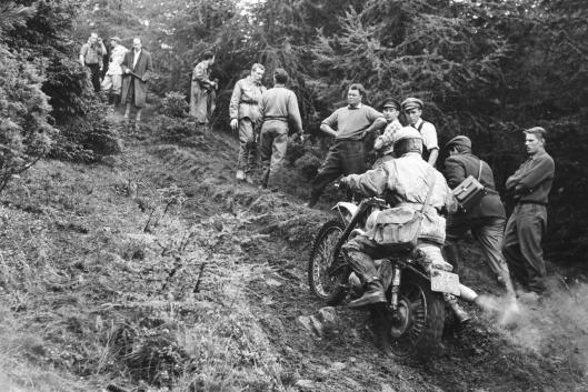 Photo - #143? R Boom of Netherlands all barboured up top and trousers with his snap bag over his shoulder gingerly legs his way up what for many was an impossible climb - Bad Aussee Austria © Erwin Jelinek/Technisches 