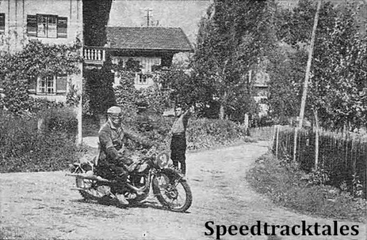 photo - Vic Britain (490 Norton) swerves a curve on the road approaching Unterwössen, a village near the end of Thursday's route. ISDT 1939 (Speedtracktales Collection)