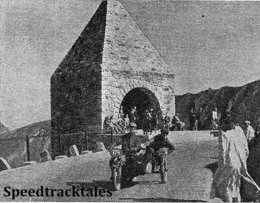 photo - Right on the top of the Grossglockner Pass is the Dolfuss Memorial, the impressive archway through which L.E.C Hall has just passed. It was included in Wednesday's run. ISDT 1939 (Speedtracktales Collection)
