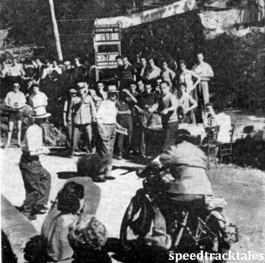 photo - Fred Rist of the British International Silver Vase Team No2 swings his 499cc BSA in towards the table at Montalto Ligure time check twelve miles from Molini di Triora. ISDT 1948 (Speedtracktales Collection)