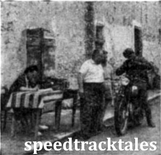 photo - Jack Stocker (499 Royal Enfield). British Vase "No. 1" team searches for his card at a check. ISDT 1948 (Speedtracktales Collection)