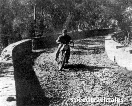 Photo - Bend after bend - and a surface worthy of observation in a one-day trial. Yet a high average speed had to be maintained over such going. The rider is A.J. Blackwell (Norton) of the British No 2 Vase Team. (Speedtracktales Collection)