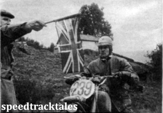 Photo - East waits for West. #239 Edwin Kruse (346 Izhevsky) eyes the starters flag at the beginning of a timed hill climb. ISDT 1961