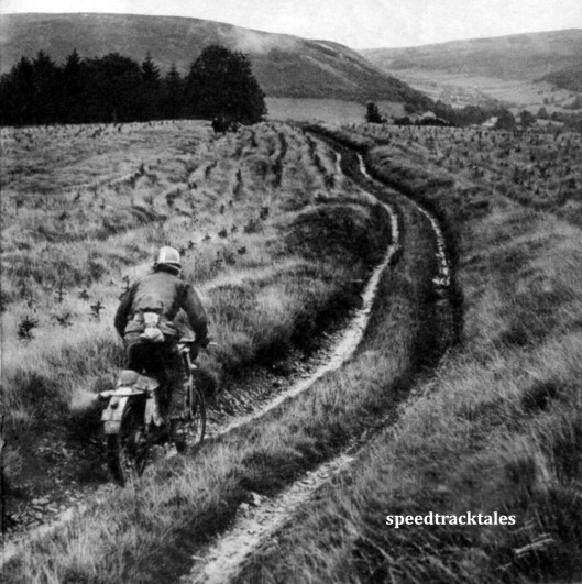 Photo - A panorama near Plynlimmon. The track is typical of many used in the trial. Swedish Trophy teamster B. Ekeberg (175 Husqvarna) is the rider. ISDT 1961