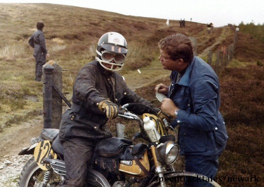 Photo - #120 J E Kelly Yamaha of Canada who retired on the first day arrives at a time check ISDT 1971 (Newark Collection)