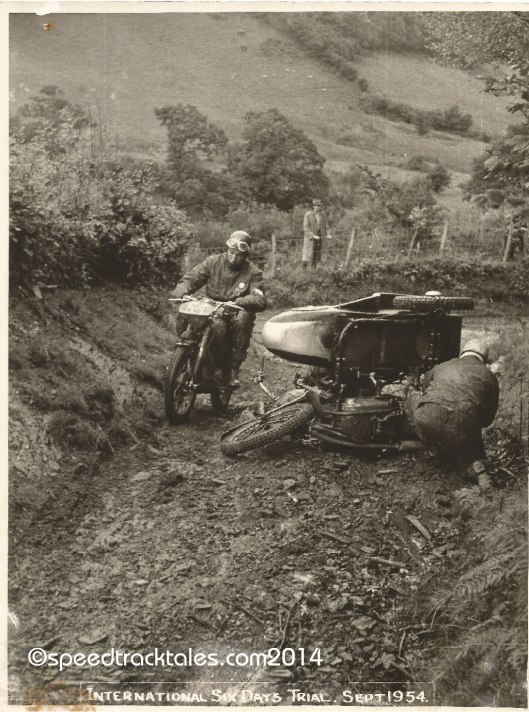 Photo - #50 WT Howard on the works entered BSA 350cc Sidecar outfit indulges in on track maintenance ISDT 1954 - (speedtracktales collection)