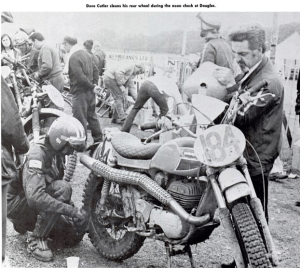 image - #184 Dave Cutler Ossa, of the USA cleans his rear wheel during the noon check at Douglas ISDT 1971
