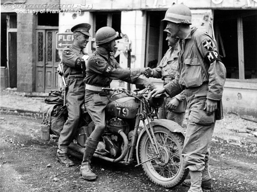 Photo - British soldier and MP on motorbike greeting American Soldiers WW2
