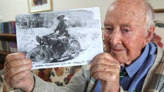 Photo - Bob Anson as a Dispatch Rider in Syria in 1952 on a 1939 Norton. (Newcastle Herald)