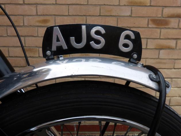 Photo - Detail of Number plate [AJS 6] Works AJS 498 of Hugh Viney ISDT 1953 (Courtesy Bonhams)