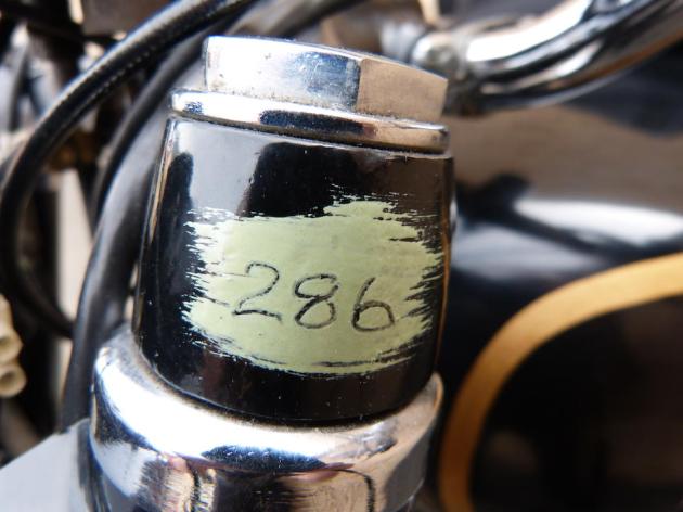 Photo - Detail of Security Seal fork leg [AJS 6] Works AJS 498 of Hugh Viney ISDT 1953 (Courtesy Bonhams)