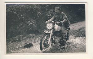 Motorcyclists splashing through water